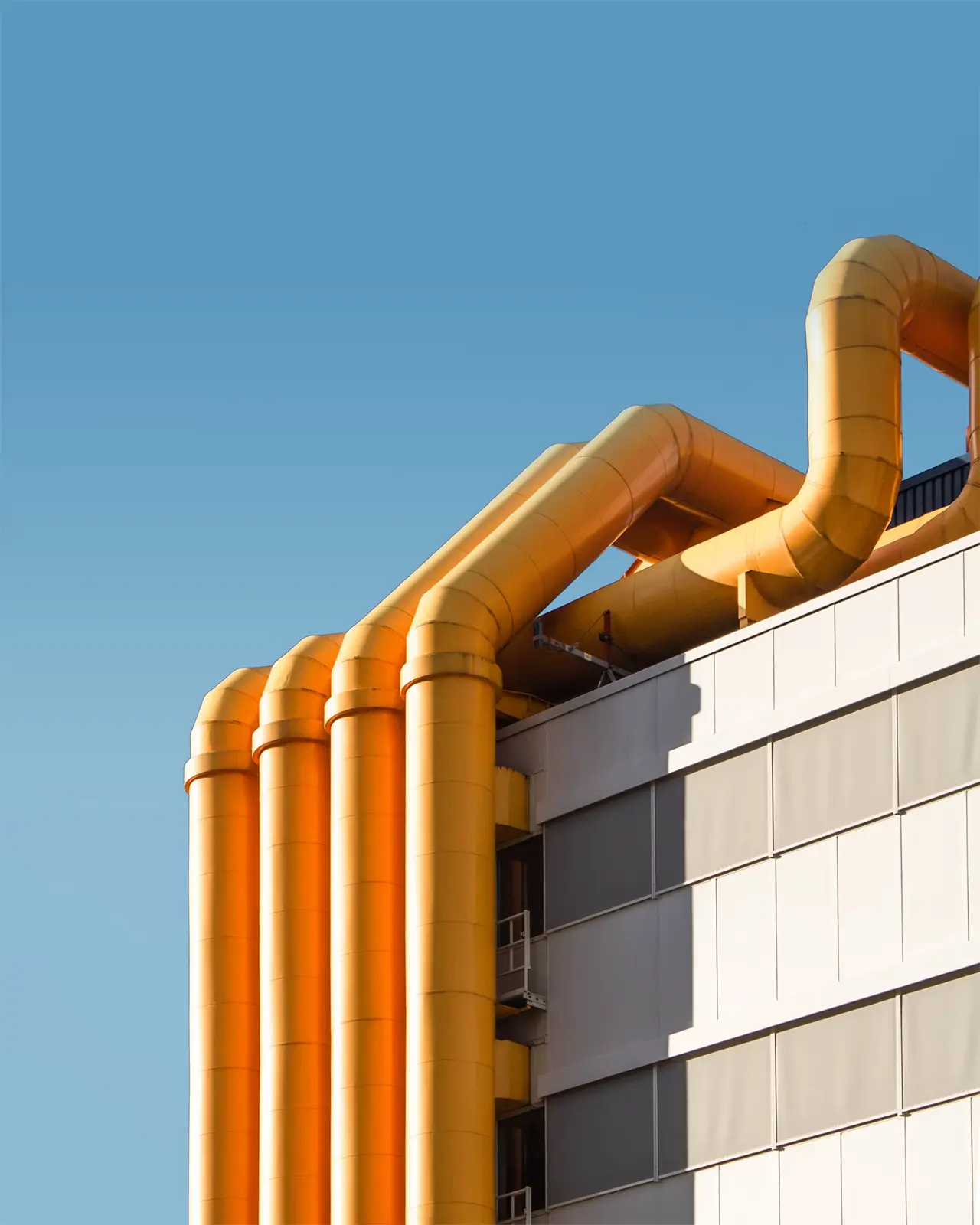 gas pipes blue sky vertical