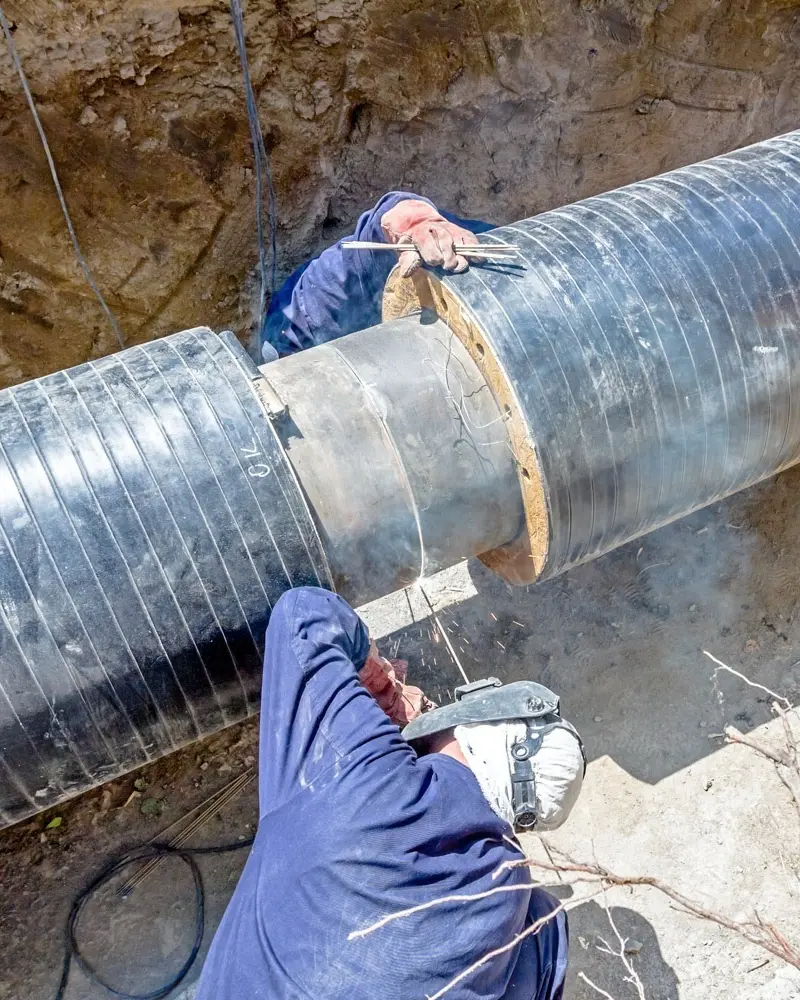 two welders pipework welding